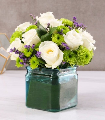 Assorted Flowers In Blue Glass Vase