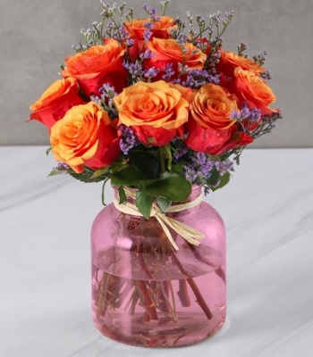 Cherry Brandy Roses in Purple Vase