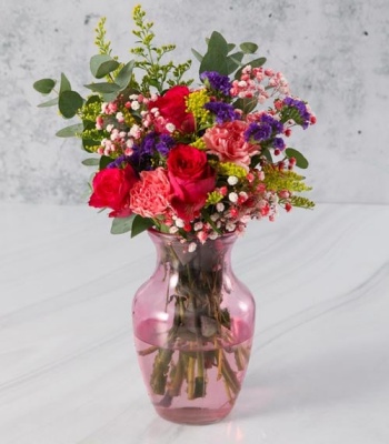 Flowers in Pink Hurricane Vase