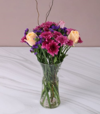 Peach and Purple Flowers in Vase