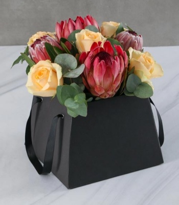 Proteas and Roses in Black Box