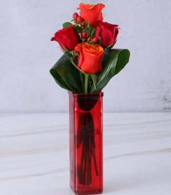 Rose Arrangement In Red Vase