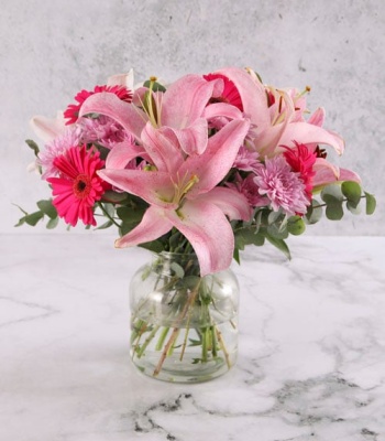 Stargazer Lilies in Round Vase