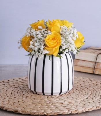 Yellow Roses In Black And White Vase