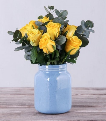 Yellow Roses In Blue Vase