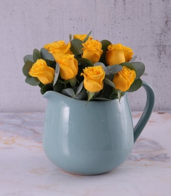 Yellow Roses In Ceramic Water Jug