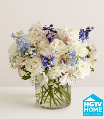 Blue and White Flowers in Glass Vase